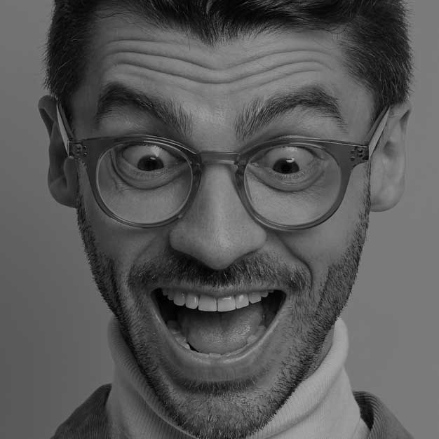 An expressive black and white portrait of a man wearing glasses An expressive black and white portrait of a man wearing glasses